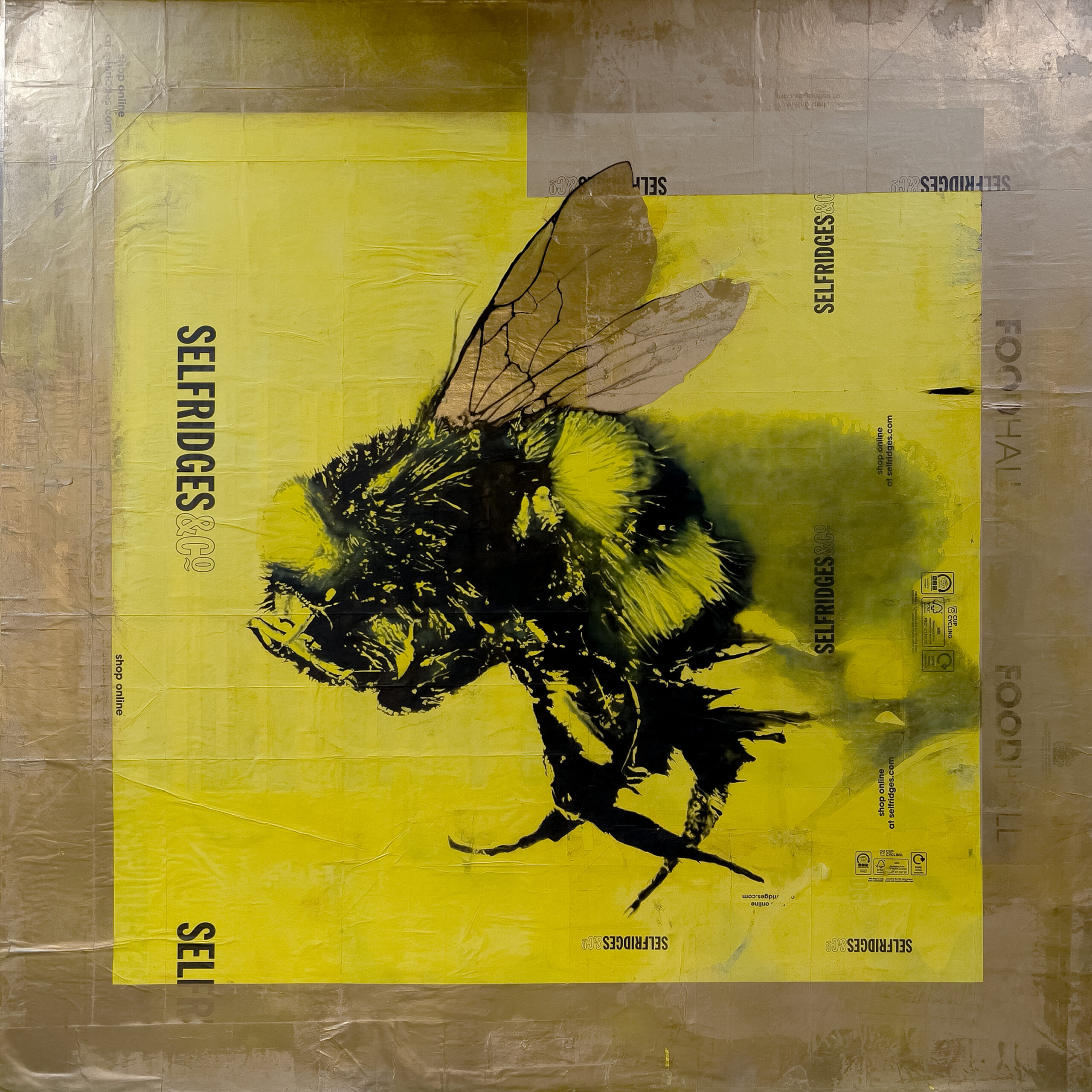A large black and yellow bee is painted over a bright yellow field made from layered Selfridges & Co packaging and printed paper.